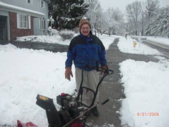 This man was having fun with his snow blower, and wanted his picture taken!
